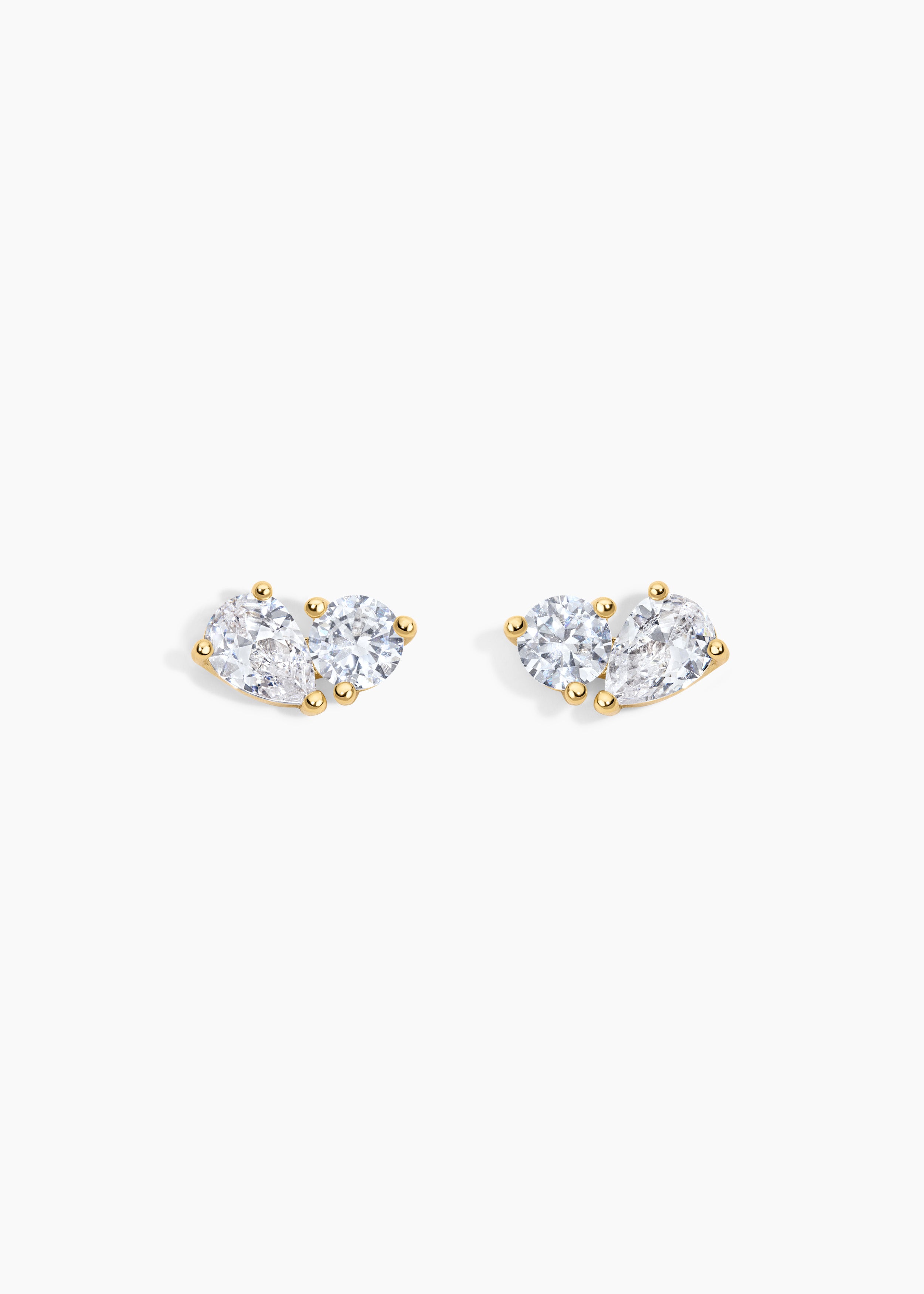The Birthday Set, gold stud earrings with a round crystal and a pear crystal side by side