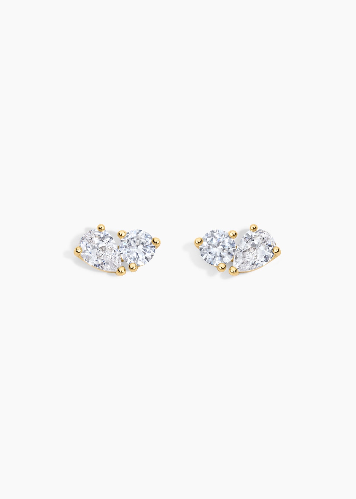 The Birthday Set, gold stud earrings with a round crystal and a pear crystal side by side