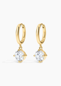 Monroe Hoops, gold huggie hoops with a prong-set round crystal drop