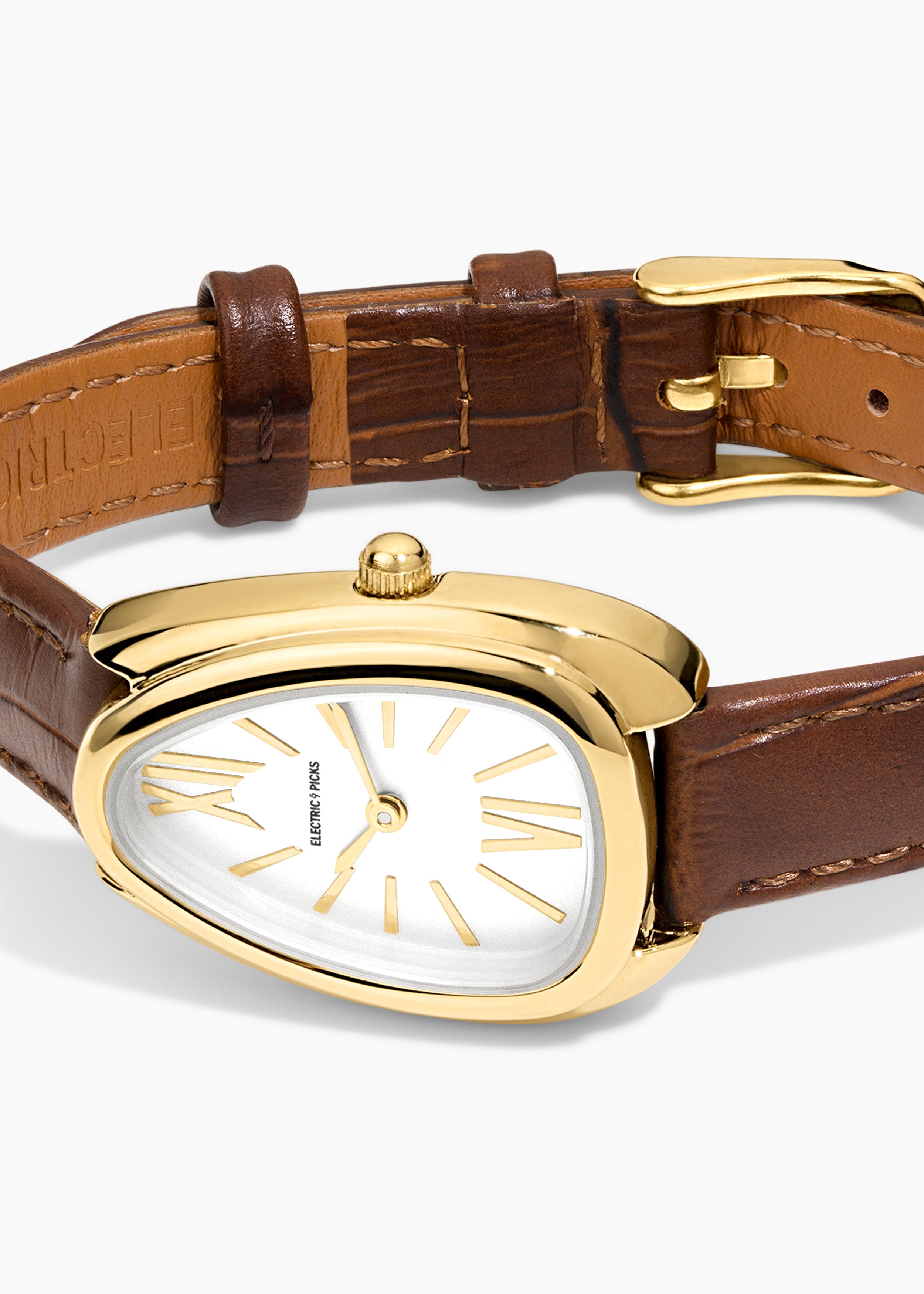Everyday Watch, gold watch with a brown leather band, close-up of the curved case and dial