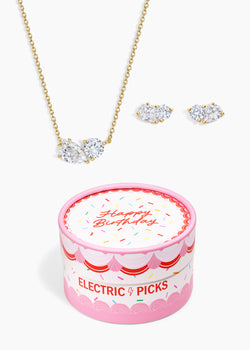 The Birthday Set, gold two-crystal necklace and matching studs with a pink Happy Birthday Electric Picks gift box