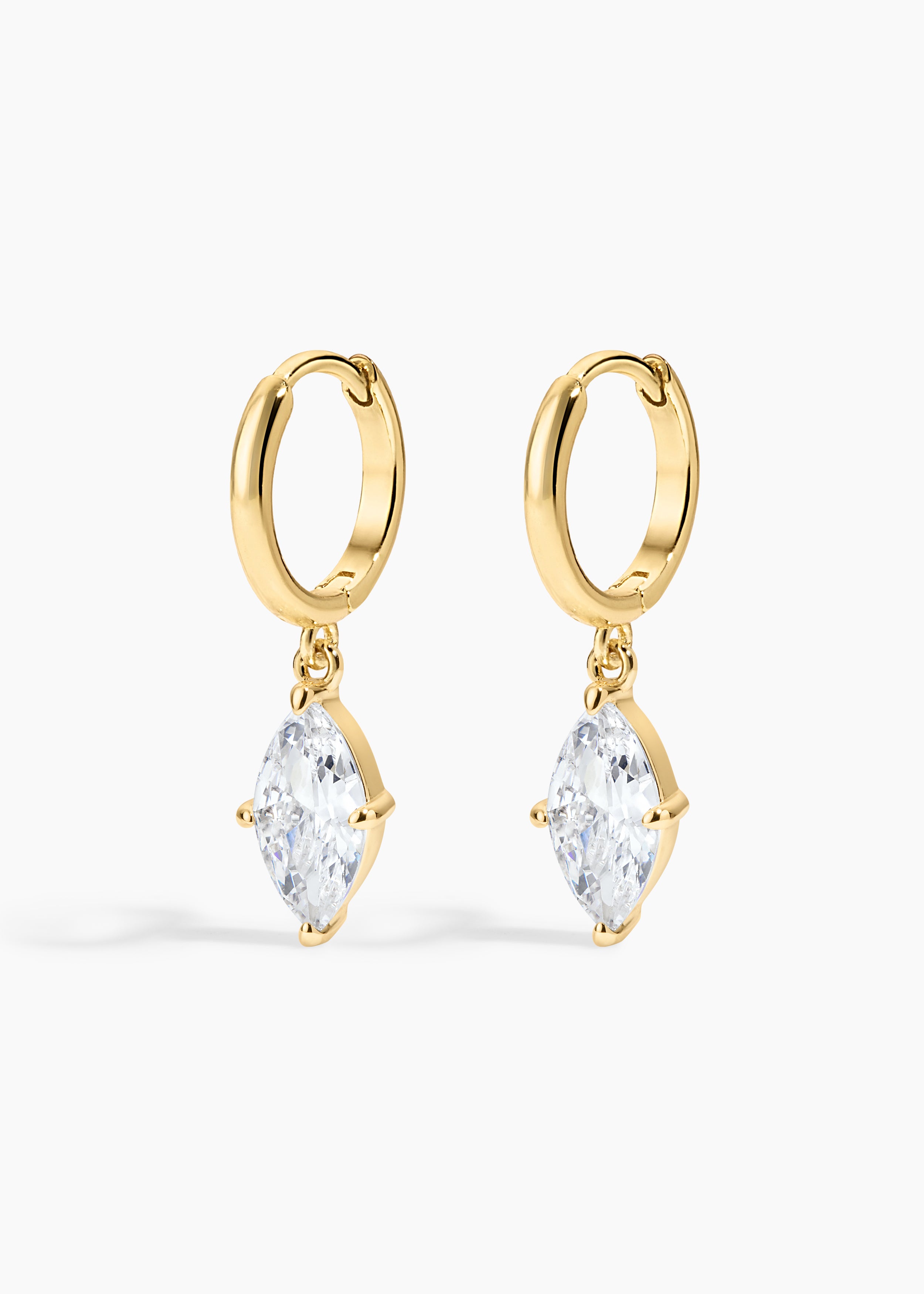 Shay Hoops, gold huggie hoops with a large marquise crystal drop