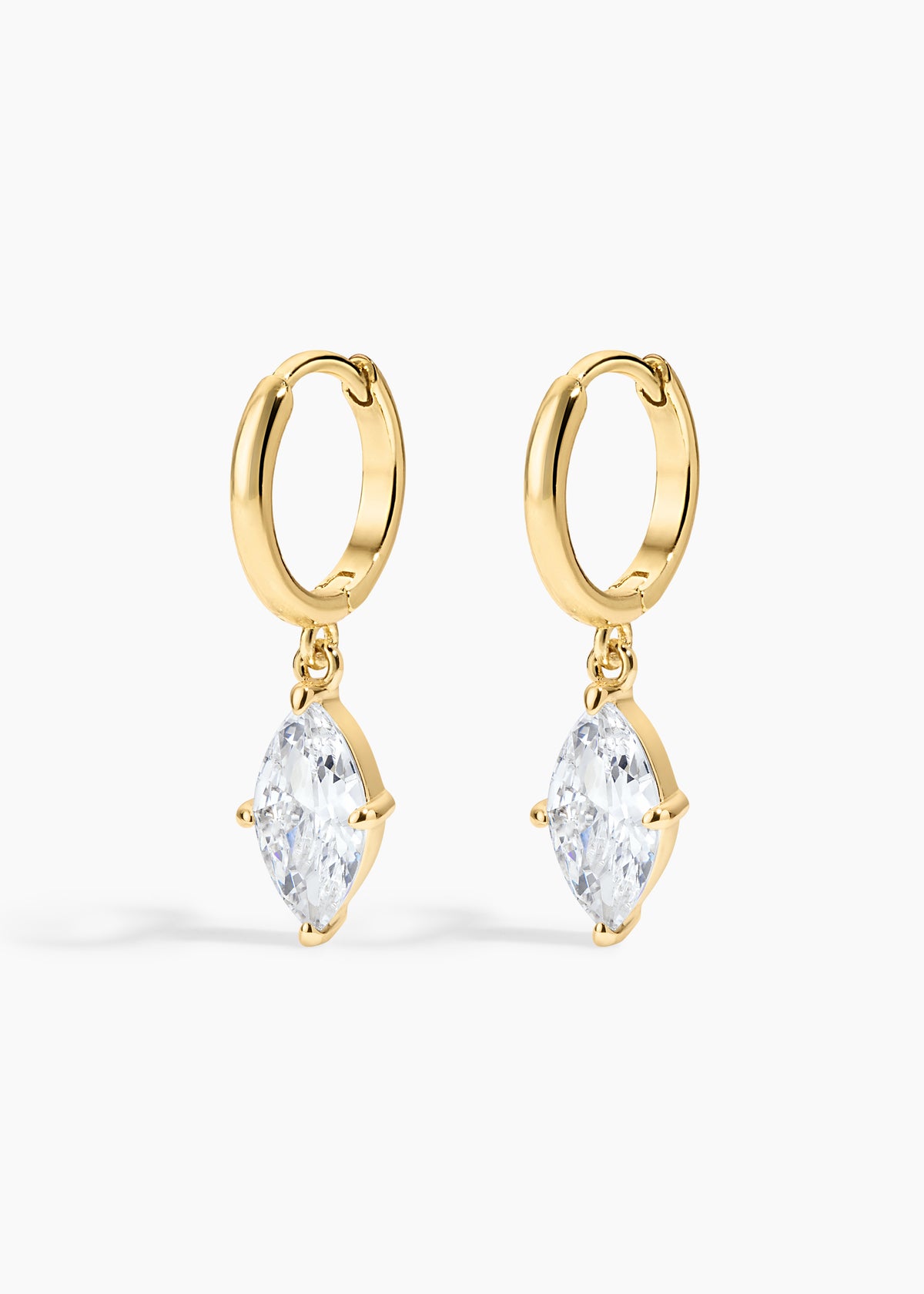 Shay Hoops, gold huggie hoops with a large marquise crystal drop